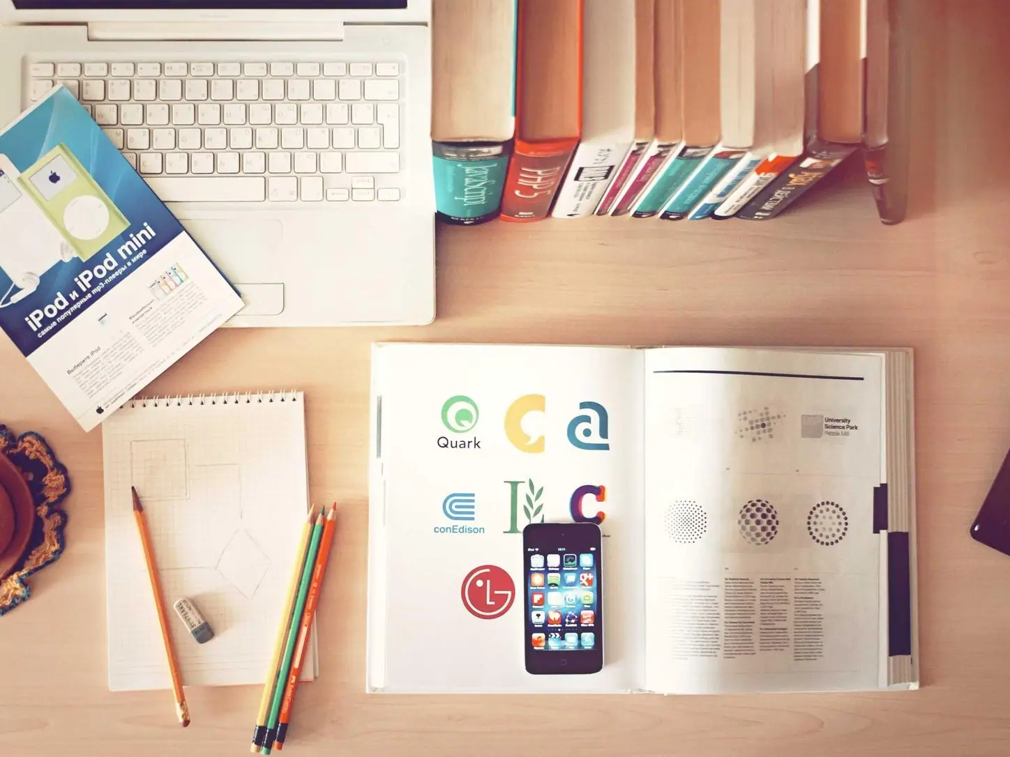 A study desk with notebooks and pens